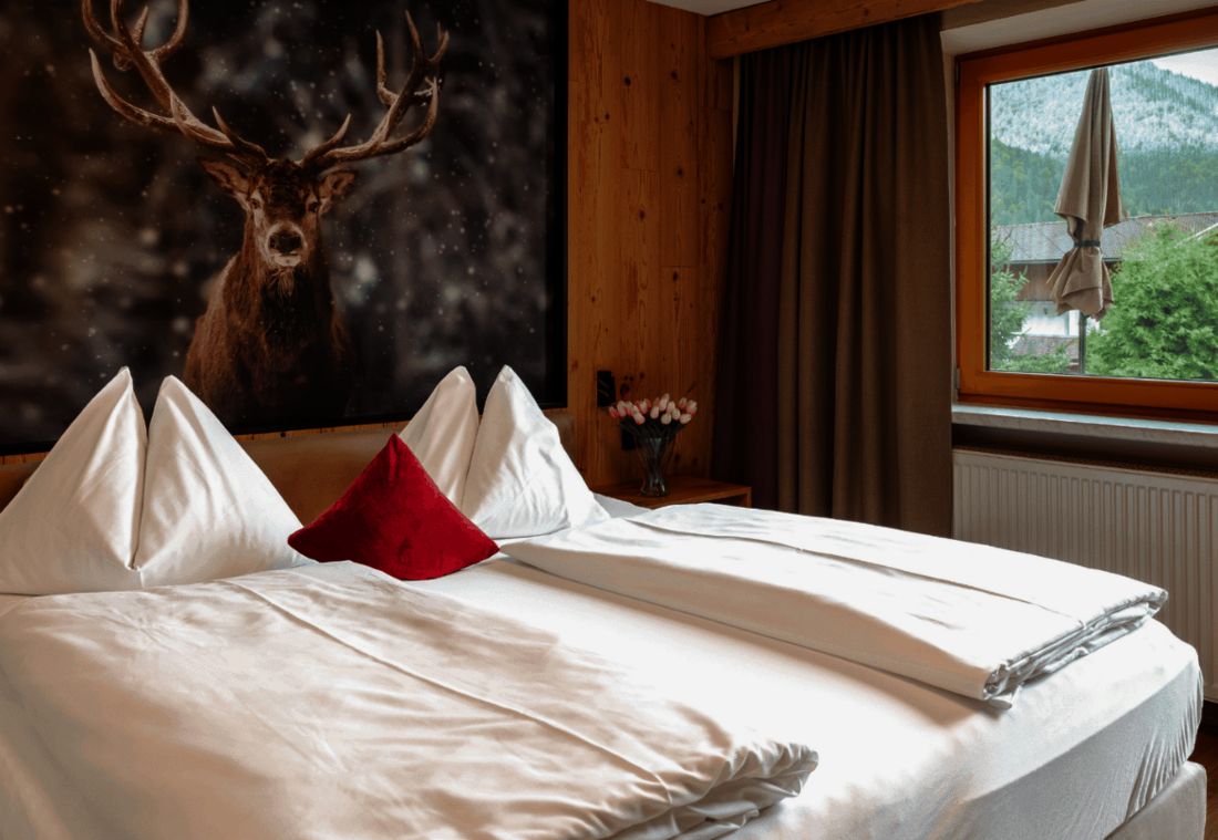 Double room with stag motif, large window and access to the balcony